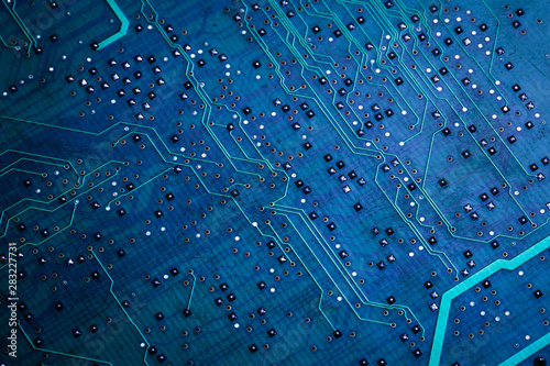 Фотография Printed green computer circuit board with many electrical components