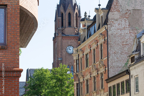 Canvastavla View on Fredrikstad Cathedral in Norway through buildings