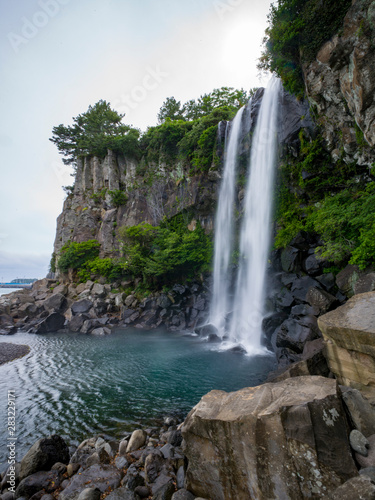 Waterfall directly into ocean - Jeongbang  Jeju  South Korea