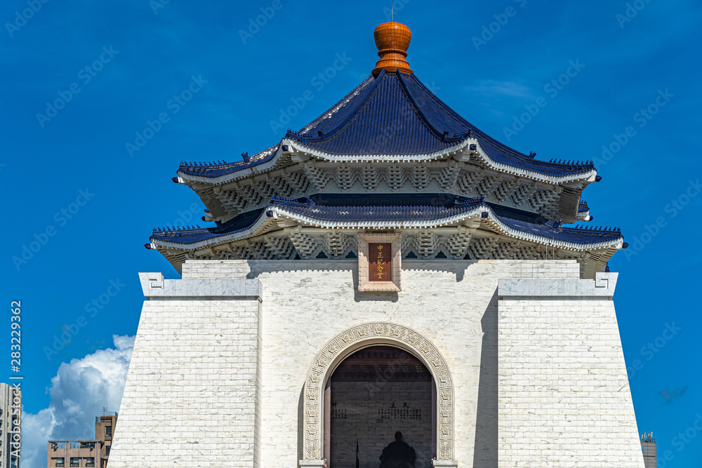 Close-up view of The National Taiwan Democracy Memorial Hall main building with clear blue sky background. Taipei, Taiwan. Text in Chinese means Close-up view of The National Taiwan Democracy Memorial Hall main building with clear blue sky background. Taipei, Taiwan. Text in Chinese means
