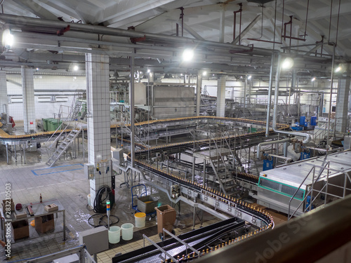 Equipment for making beer..Automatic Beer bottling line. modern brewery. production process of brewing. Beer production mode. Interior view of modern conveyor shop for bottling products