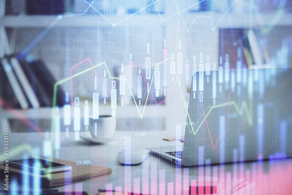 Stock market chart hologram drawn on personal computer background. Double exposure. Concept of investment. Stock market chart hologram drawn on personal computer background. Double exposure. Concept of investment.