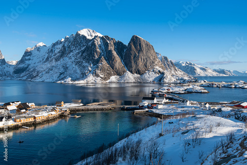 Fishermen’s cabins (rorbu) in the Hamnoy village under blue sky in winter season, Lofoten islands, Norway