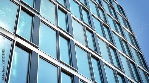  Modern office building with reflection in windows of building. New office building in the city center.