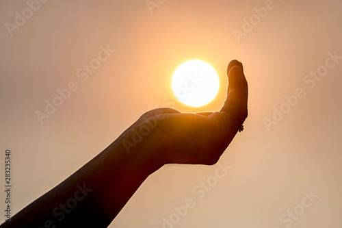 Holding the sun in the palm.