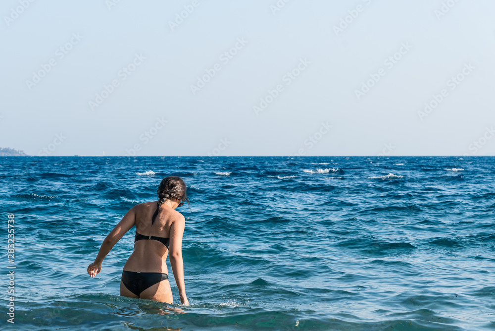 Young beautiful girl in the sea Young beautiful girl in the sea