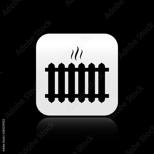 Black Heating radiator icon isolated on black background. Silver square button. Vector Illustration