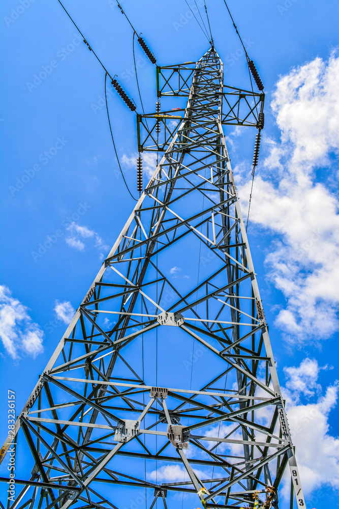 power transmission tower on background of blue sky