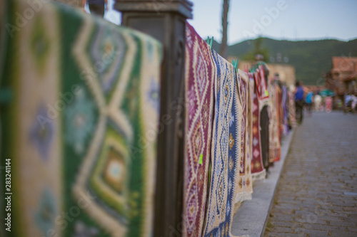 carpets on the street market © Danila