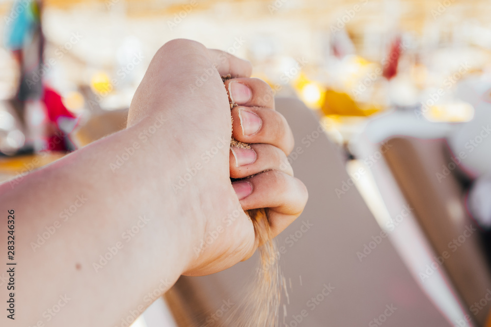 Obraz premium hand with sand