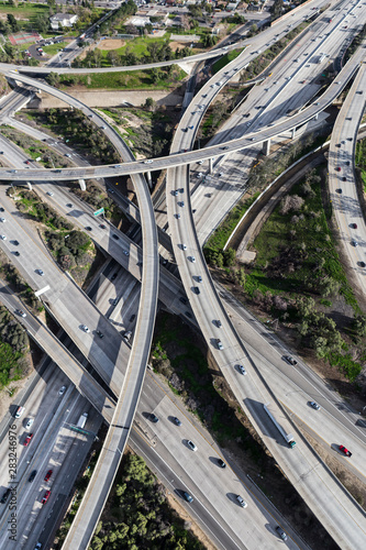 Vertical aerial view of Interstate 5 and Route 118 freeway ramps and bridges in the San Fernando Valley area of Los Angeles, California.