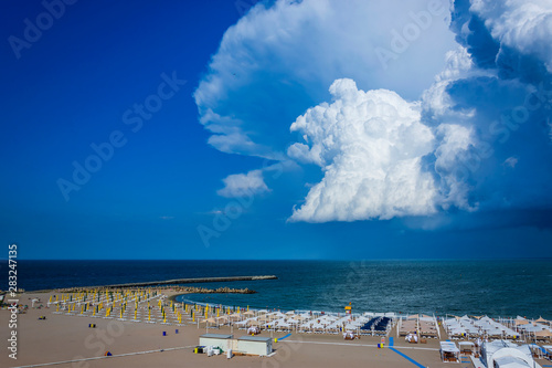 Famous beach and stormy sky at Faleza Nord coast in Constanta , Romania. photo