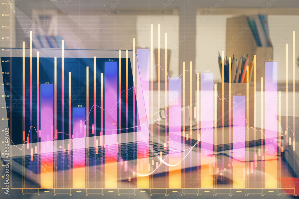 Forex Chart hologram on table with computer background. Double exposure. Concept of financial markets. Forex Chart hologram on table with computer background. Double exposure. Concept of financial markets.