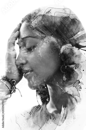 Paintography. Double Exposure portrait of a beautiful ethnic woman's profile combined with hand drawn painting with floral motifs. black and white