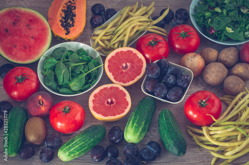 healthy diet  kitchen table full of fruits and vegetables