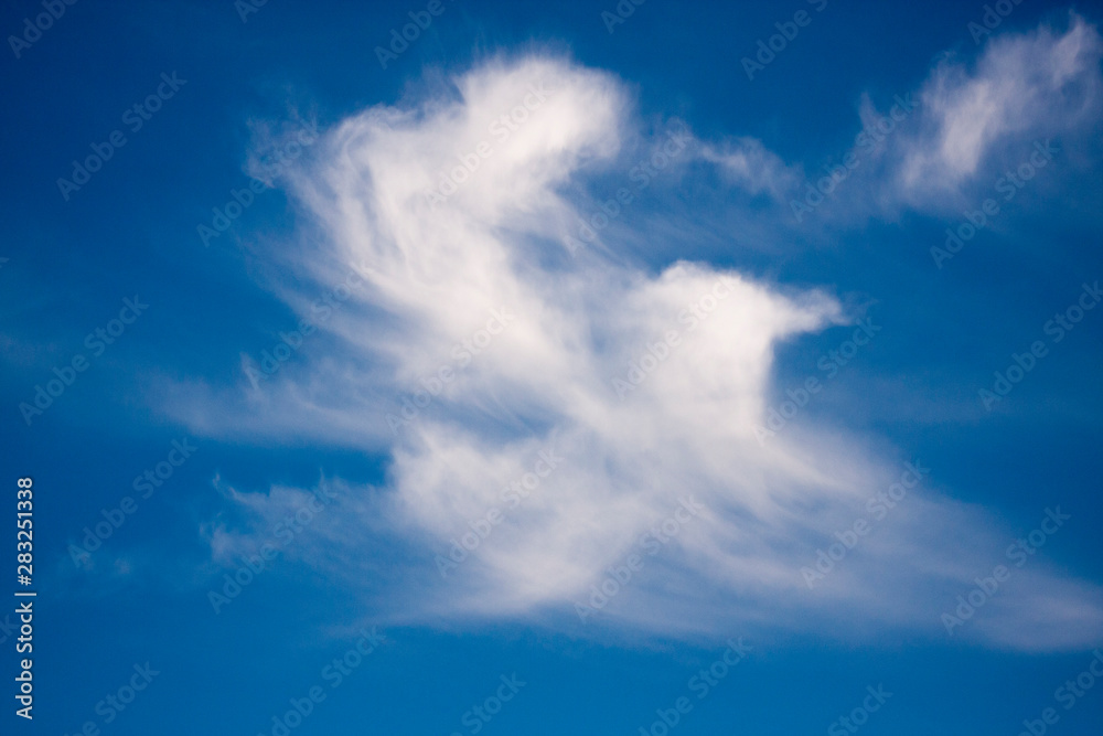 white fluffy clouds in the blue sky white fluffy clouds in the blue sky