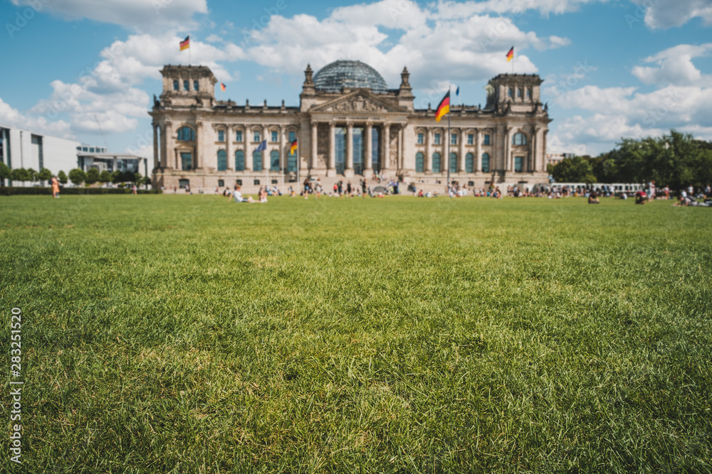 Meadow in front of the Reichstag building ( the German Bundestag ) in Berlin ,Germany