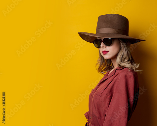 Woman in 1940s style clothes and sunglasses