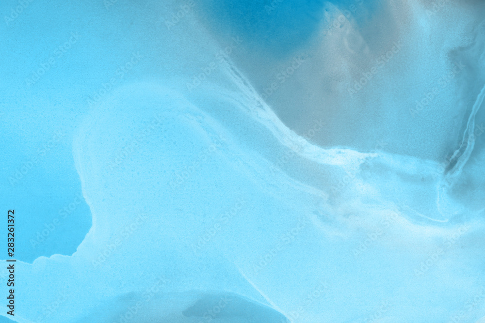 Hand painted blue alcohol ink background. Abstract delicate winter season texture. Contemporary wallpaper. Hand painted blue alcohol ink background. Abstract delicate winter season texture. Contemporary wallpaper.