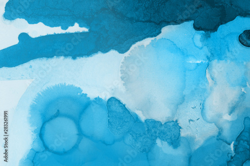 Hand painted blue alcohol ink background. Abstract delicate winter season texture. Contemporary wallpaper. © artistmef