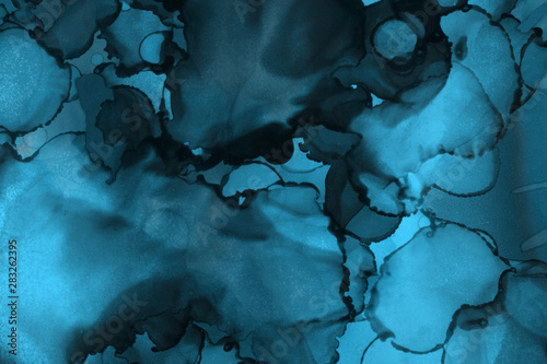 Hand painted blue alcohol ink background. Abstract delicate winter season texture. Contemporary wallpaper. 