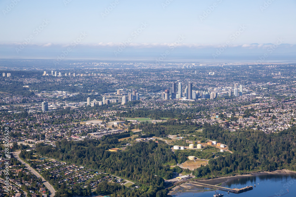 Aerial view of a modern cityscape during a sunny summer morning. Taken in Burnaby, Greater Vancouver, British Columbia, Canada.