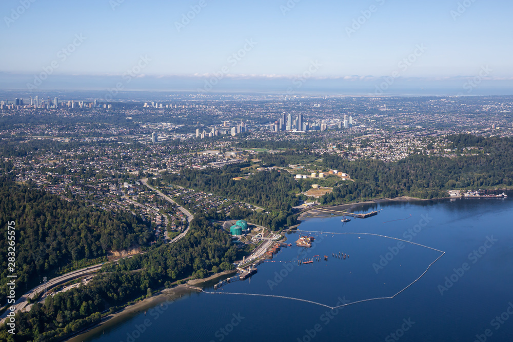 Aerial view of Oil Refinery Industry in Port Moody, Greater Vancouver, British Columbia, Canada. Taken during a sunny summer morning.