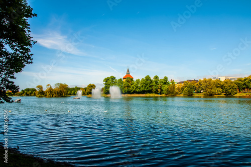 The beautiful landscape of the Pildammsparken lake in the city of Malmo photo