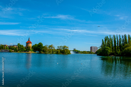 The beautiful landscape of the Pildammsparken lake in the city of Malmo photo