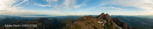 Beautiful Aerial Panoramic view of Canadian Mountain Landscape during a vibrant summer sunset. Taken at Mt Arrowsmith, near Nanaimo and Port Alberni, Vancouver Island, BC, Canada.