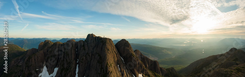 Beautiful Aerial Panoramic view of Canadian Mountain Landscape during a vibrant summer sunset. Taken at Mt Arrowsmith, near Nanaimo and Port Alberni, Vancouver Island, BC, Canada.