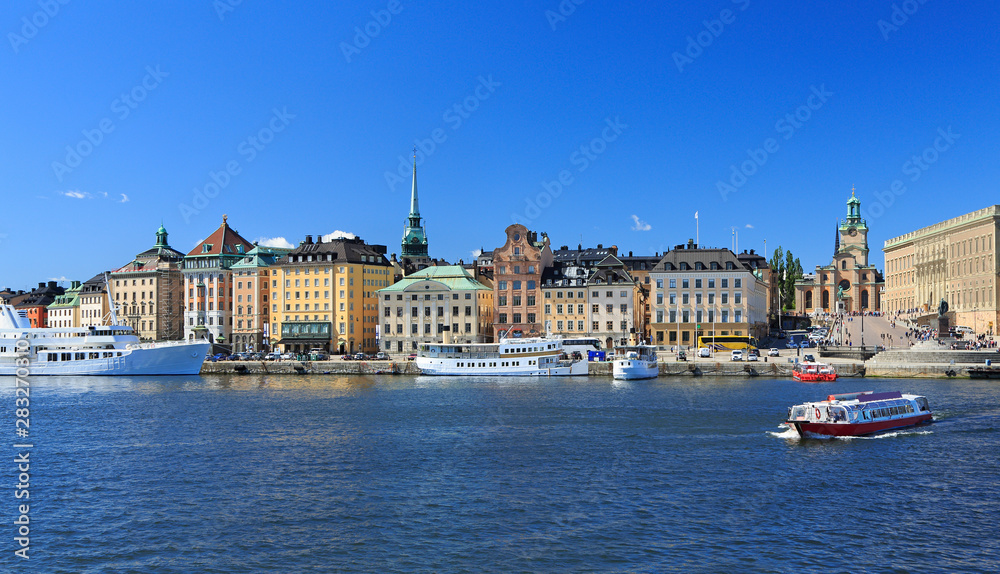 Scenic view of Stockholm's Old Town (Gamla Stan) with a passenger ship on the foreground, Sweden