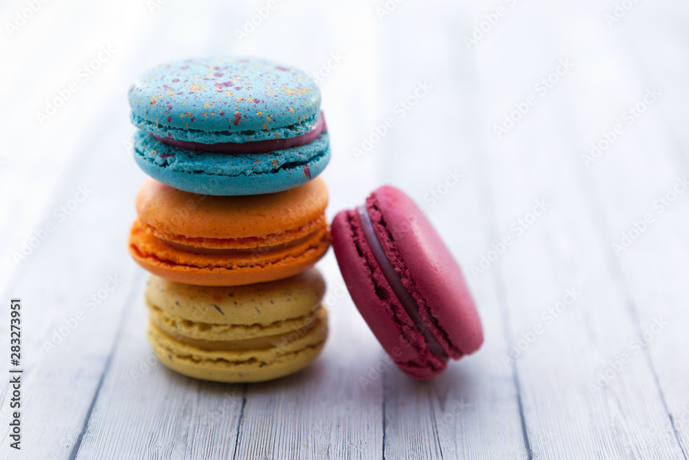 French crash macarons. Stack of colorful macaroon on wooden table French crash macarons. Stack of colorful macaroon on wooden table