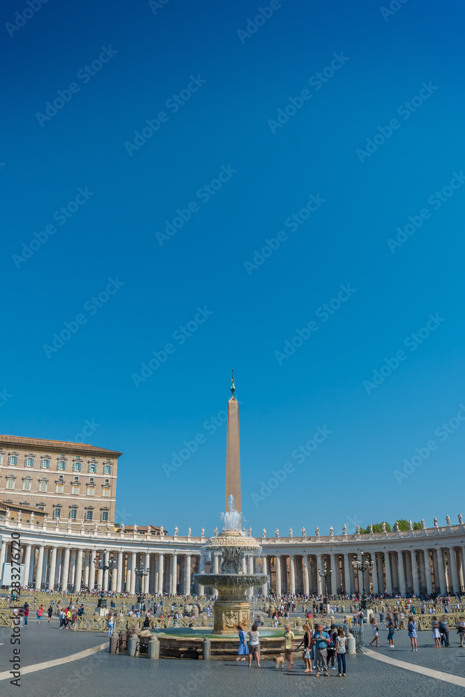The Bernini Fountain and the Egyptian Obelisk in the center and the Doric colonnades surrounding St. Peter's Square in the Vatican