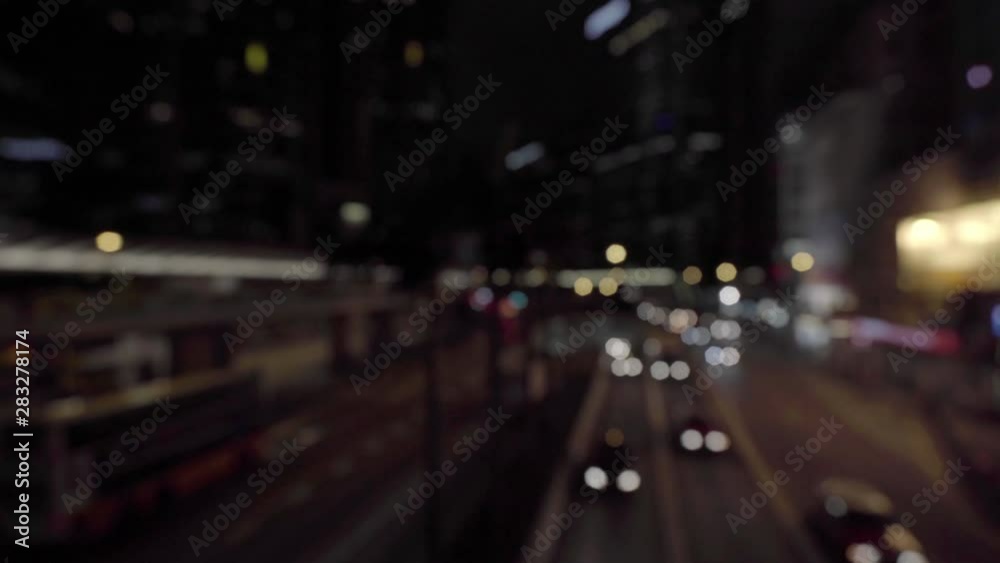 A stylized shot of traffic flowing under an overpass in the evening. A stylized shot of traffic flowing under an overpass in the evening.