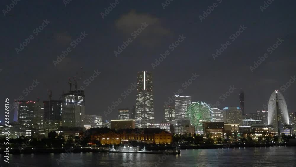 Yokohama Japan - A smooth shot of Yokohama in the evening facing toward the harbor and the iconic ferris wheel. Yokohama Japan - A smooth shot of Yokohama in the evening facing toward the harbor and the iconic ferris wheel.