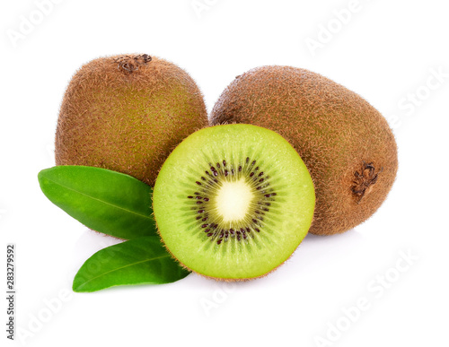 A half and a whole of Kiwi fruits and green leaf isolated on white background