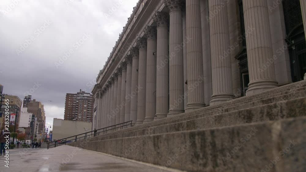 Iconic Penn Station And Beautiful NYC Skyscrapers From NYC Street While Pedestrians Walk By In Beautiful New York City