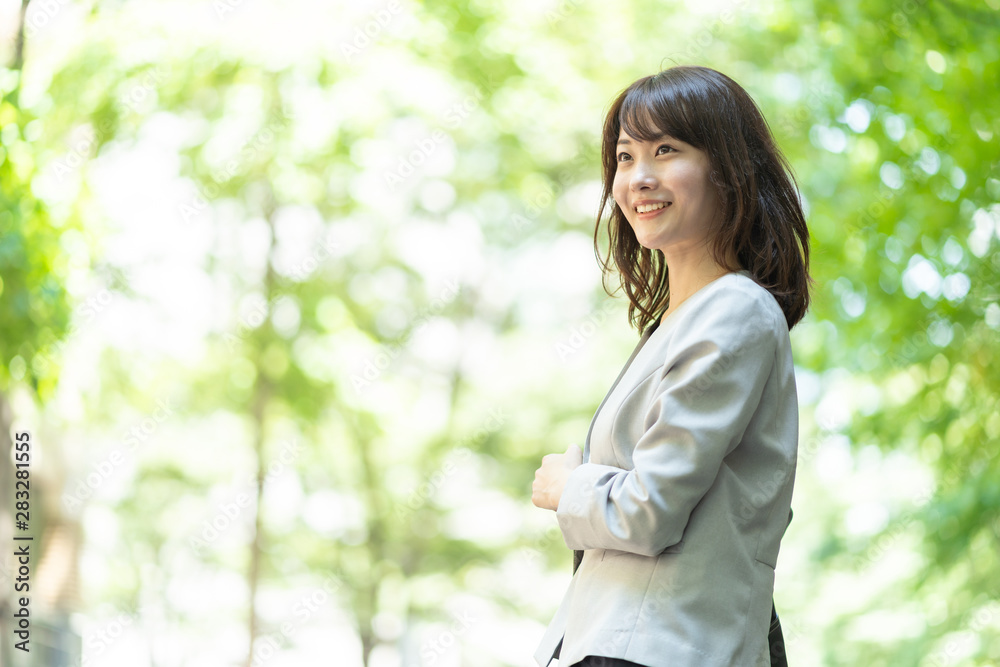 portrait of asian businesswoman walking in sidewalk portrait of asian businesswoman walking in sidewalk