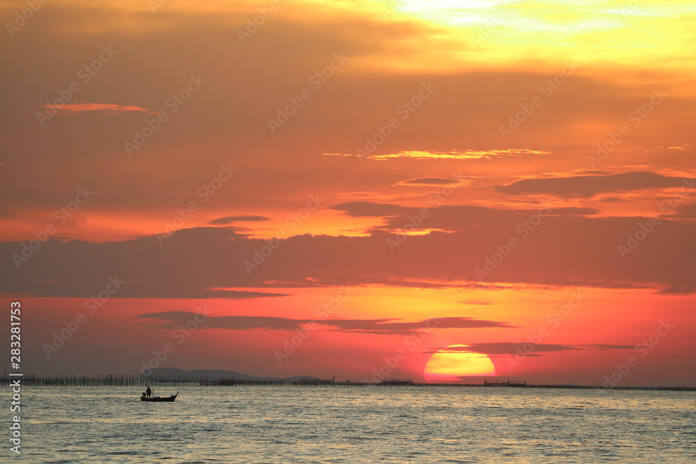 sunset on red yellow sky back evening cloud over horizon sea