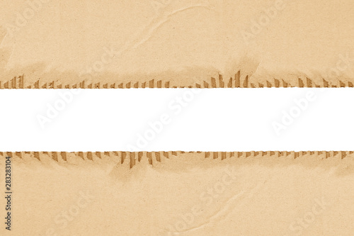 Brown corrugated or cardboard sheet texture paper torn backgroundof