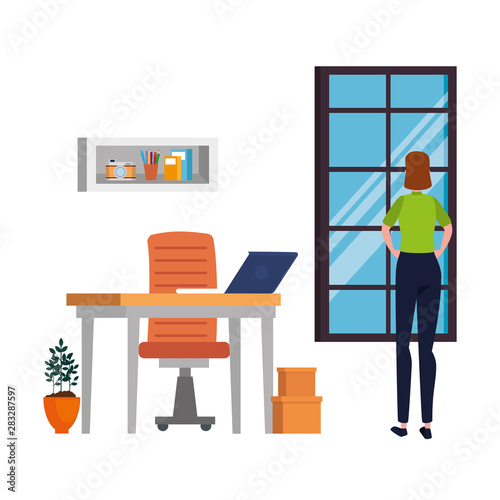 woman in office workplace scene with laptop