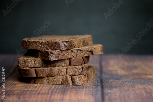 Sliced dark brown bread made of rye and wheat flour