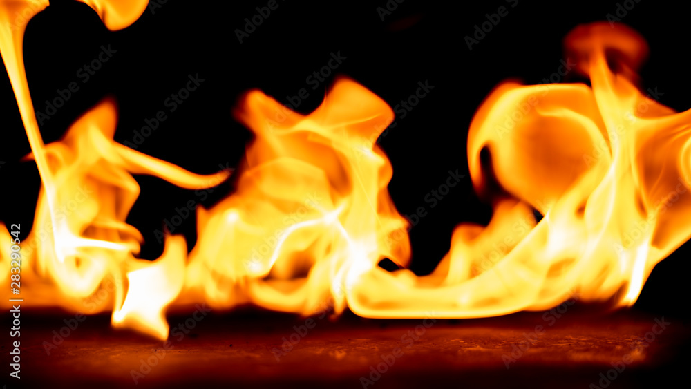 Fototapeta premium Fire on black background.