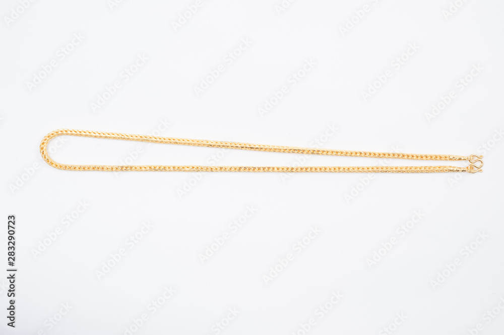 Gold chain necklace isolated on white background. Gold chain necklace isolated on white background.