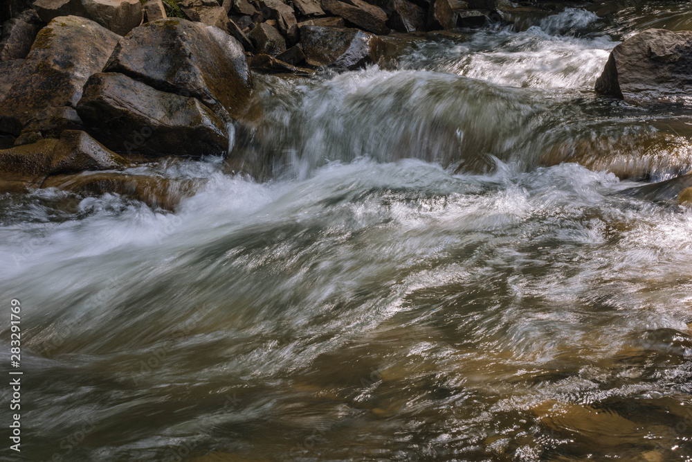 water flowing over rocks water flowing over rocks