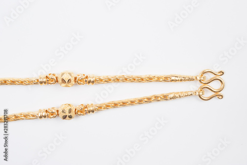 Gold chain necklace isolated on white background.