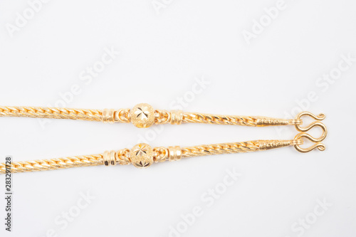 Gold chain necklace isolated on white background. © superbphoto95