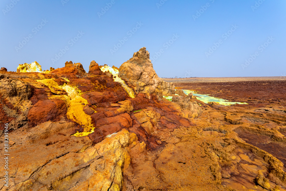 Obraz premium Beautiful small sulfur lakes Dallol, Ethiopia. Danakil Depression is the hottest place on Earth in terms of year-round average temperatures. It is also one of the lowest places on the planet