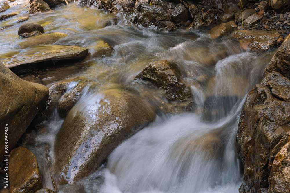 water flowing over rocks water flowing over rocks